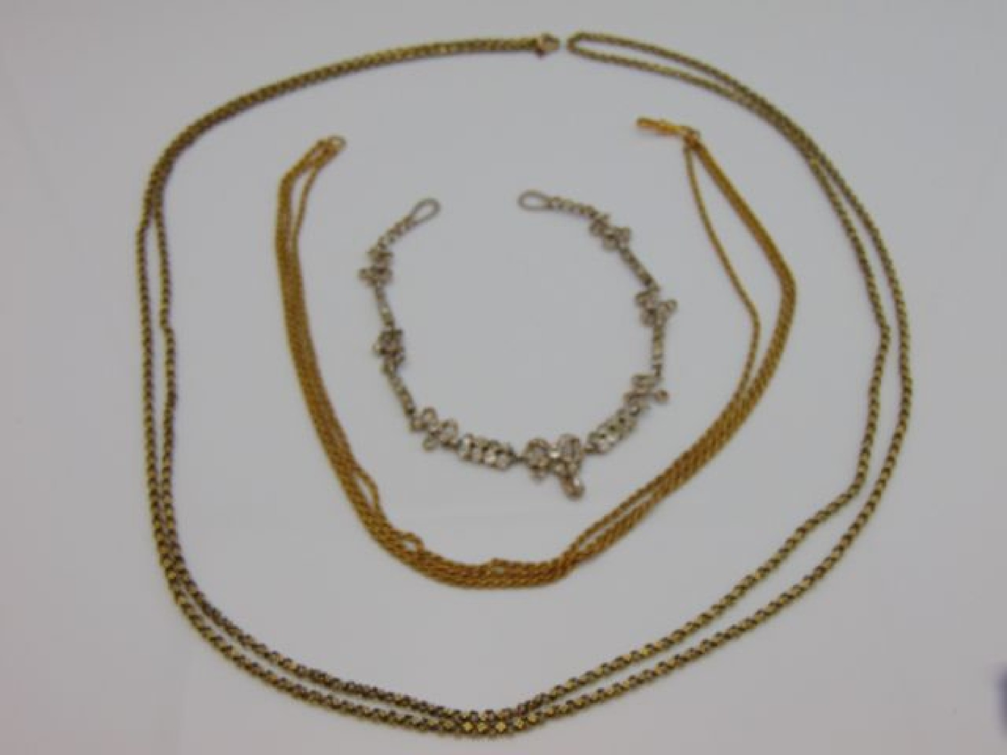 Appraisal: A pinchbeck muff chain composed of flower head links length