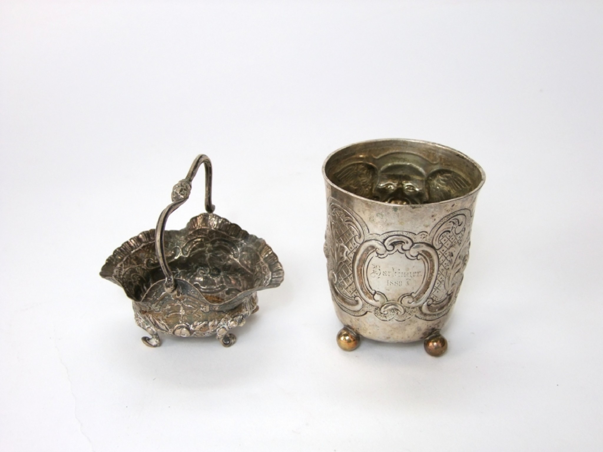 Appraisal: A th century German silver beaker cylindrical with embossed mask