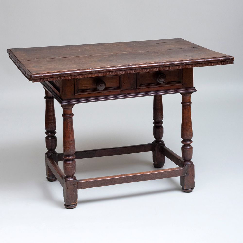 Appraisal: Italian Carved Walnut Table Tuscany Fitted with two short drawers