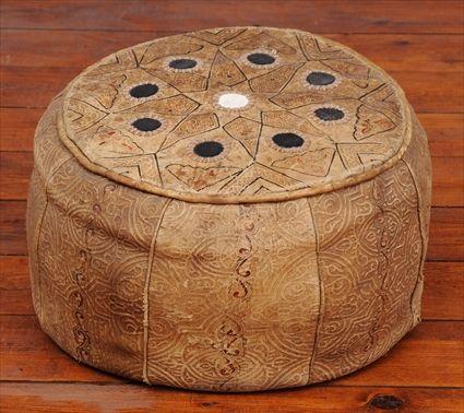 Appraisal: MOROCCAN LEATHER-UPHOLSTERED HASSOCK The round body with polychrome and embossed