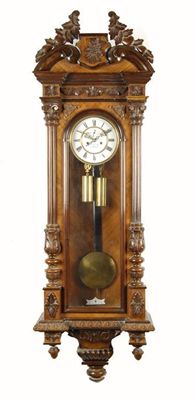 Appraisal: A walnut 'Vienna regulator' wall clock with twin barrel movement