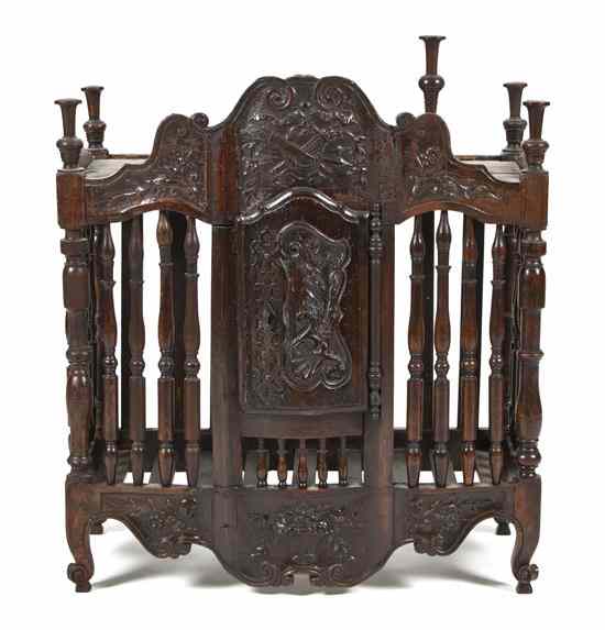 Appraisal: A French Carved Walnut Panetiere with a shaped cornice and