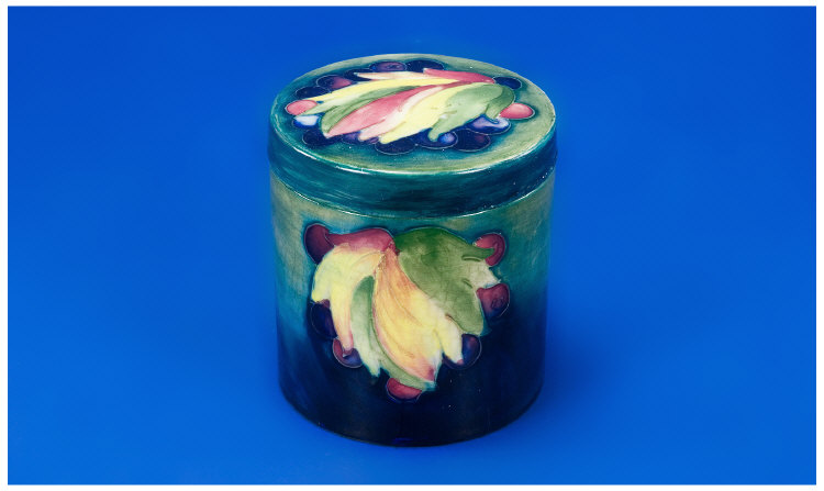 Appraisal: Moorcroft Circular Pot and Cover with leaf and berry pattern