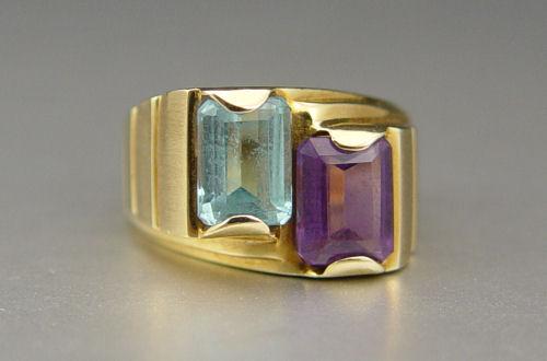 Appraisal: AMETHYST AND TOPAZ RING K yellow gold ring contains an