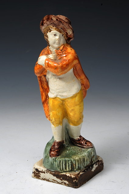 Appraisal: A PEARLWARE FIGURE 'WINTER' circa cm high