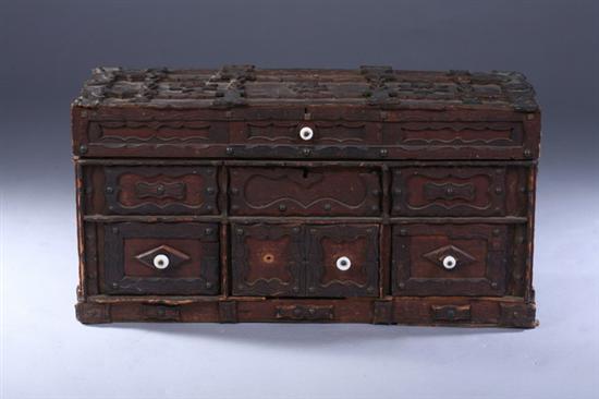 Appraisal: TRAMP ART CARVED AND PANELLED DIMINUTIVE TRUNK early th century