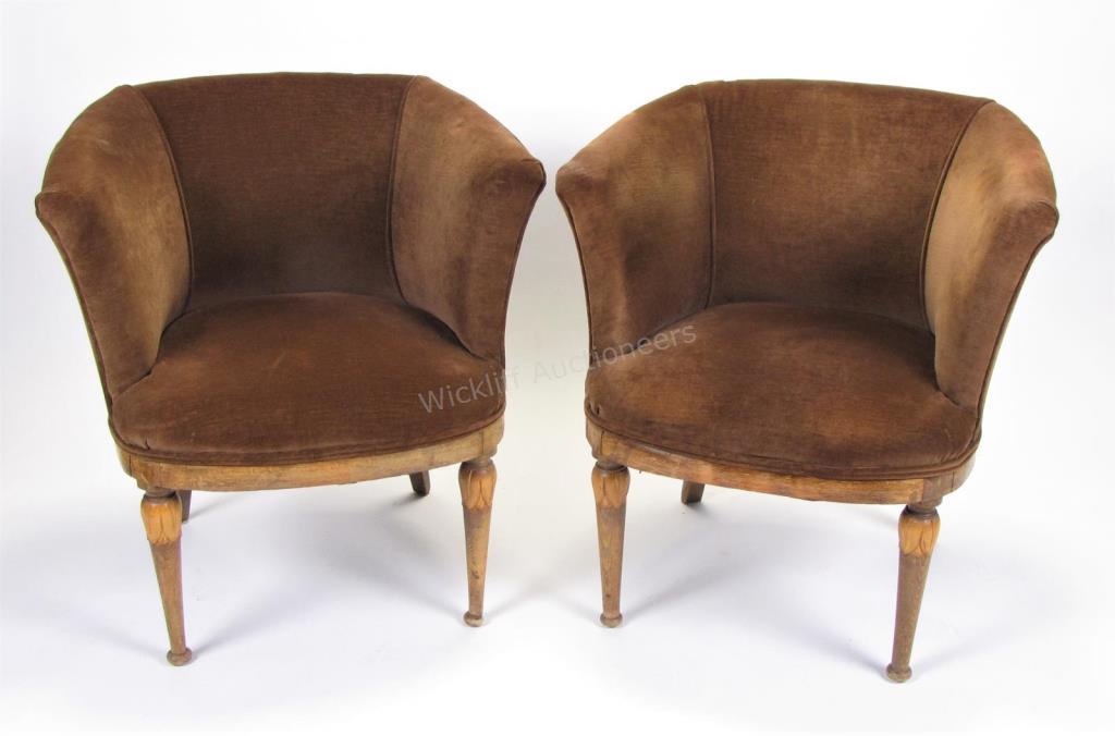 Appraisal: A pair of upholstered barrel-type chairs carved legs velvet upholstery