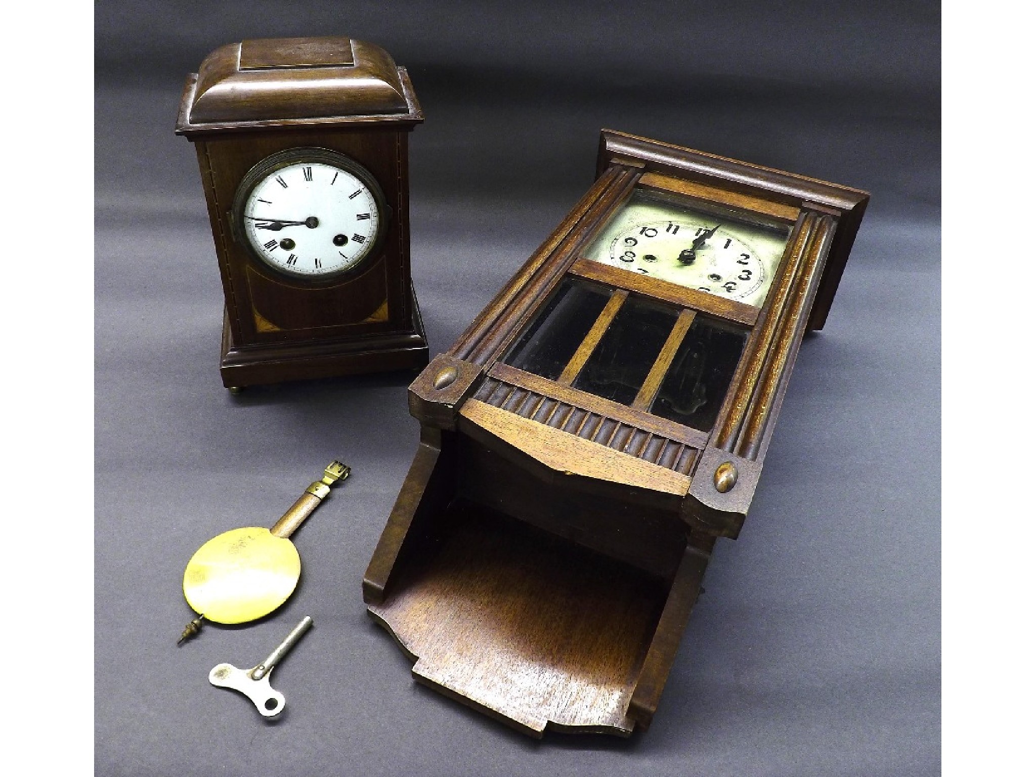 Appraisal: Edwardian mahogany and boxwood inlaid two train mantel clock high