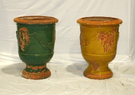 Appraisal: A matched pair of terracotta urn-form jardinieres one with a