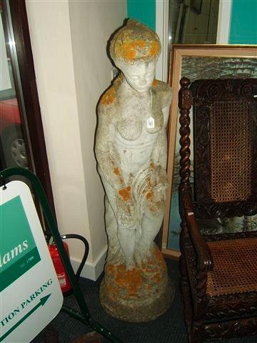 Appraisal: A reconstituted stone figure of a bathing maiden standing on