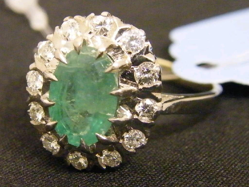 Appraisal: ct white gold oval emerald and diamond cluster ring the