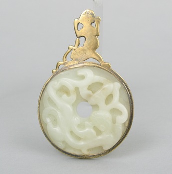 Appraisal: Carved Jade Disc Bi in a Gold Metal Mount A