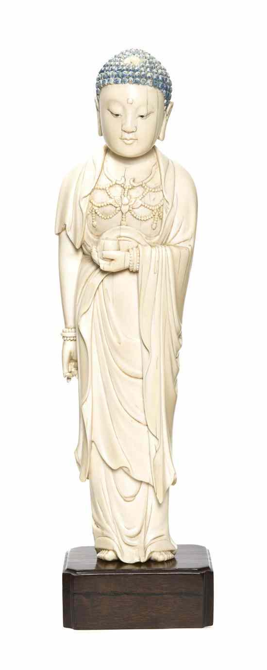 Appraisal: A Standing Ivory Figure of Buddha depicted with a downcast