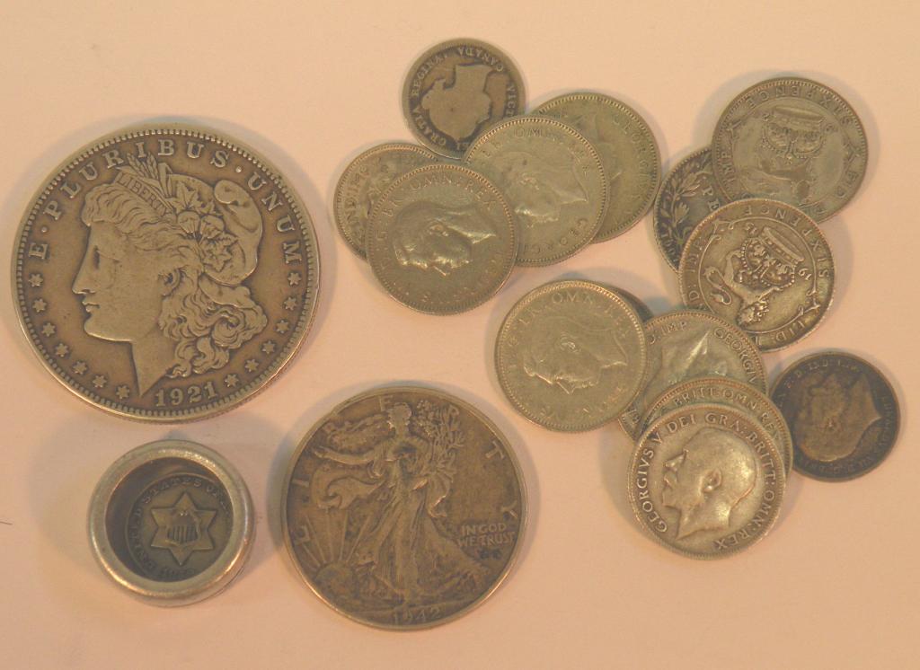 Appraisal: A American one dollar coin a half dollar and various