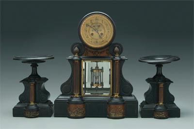 Appraisal: Polished slate clock and garniture clock with open ruby escapement