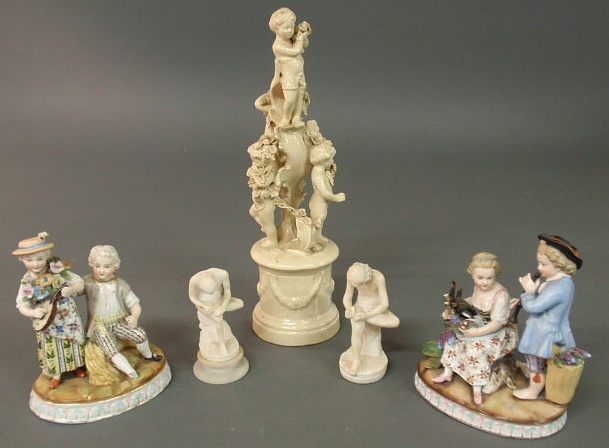 Appraisal: Two Continental porcelain figural groups h Italian ceramic putti group