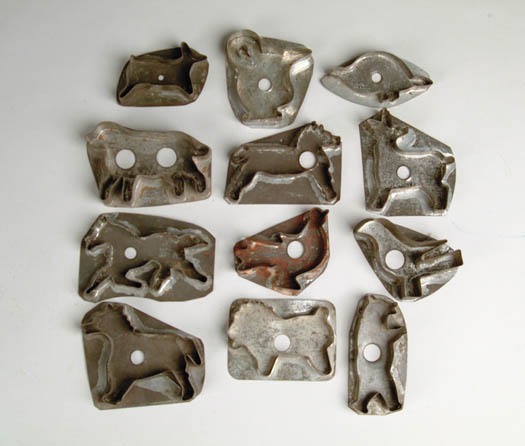 Appraisal: TWELVE TIN FIGURAL COOKIE CUTTERS All with flat backs no