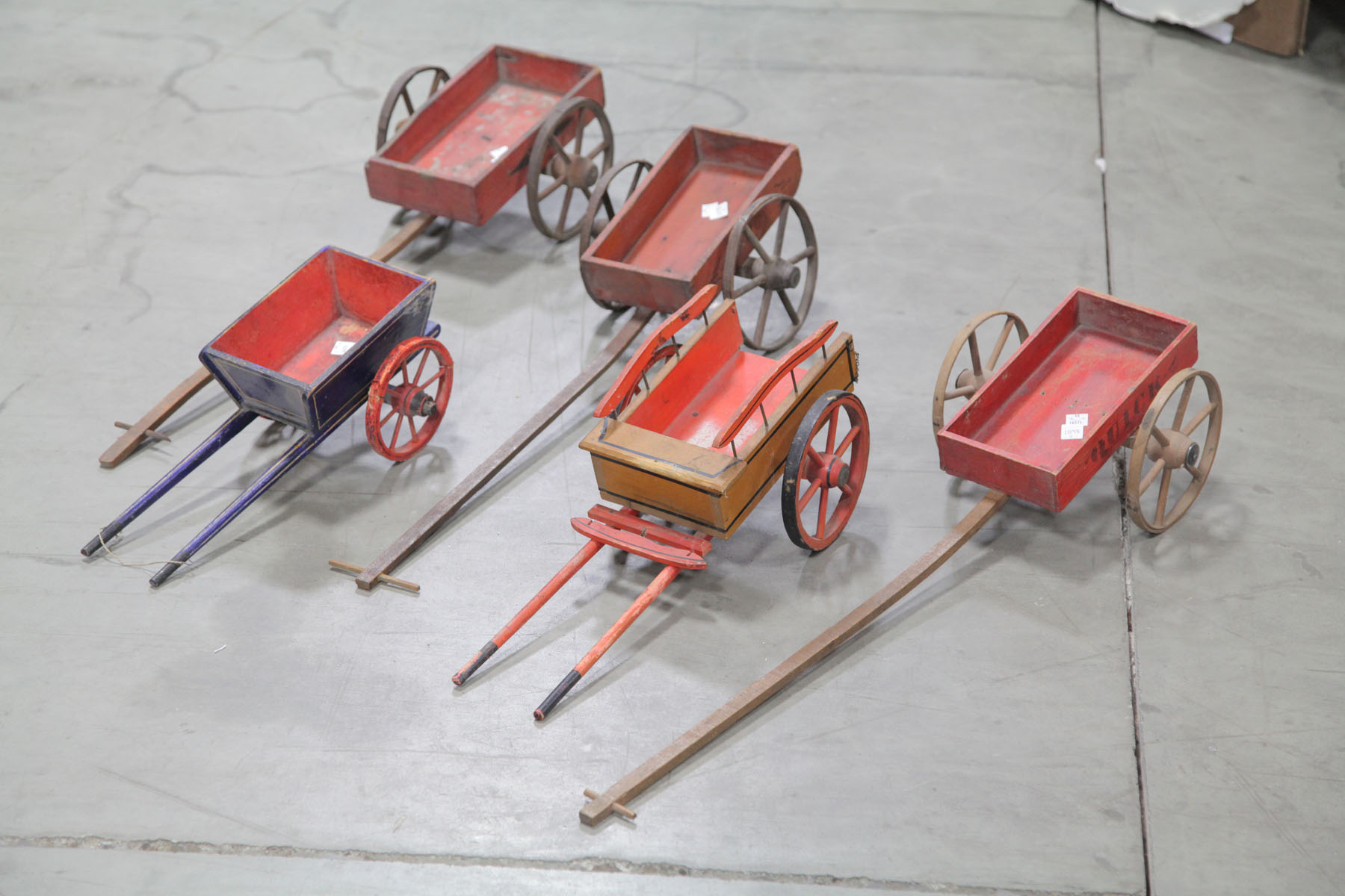 Appraisal: FIVE WOODEN TOY WAGONS American first half of th century