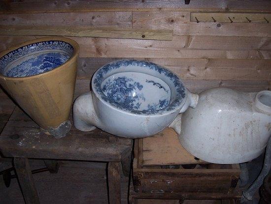 Appraisal: A brown glazed lavatory bowl the interior transfer printed in