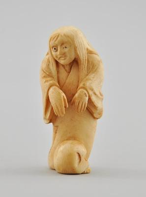 Appraisal: A Carved Ivory Netsuke The carved figure of an old