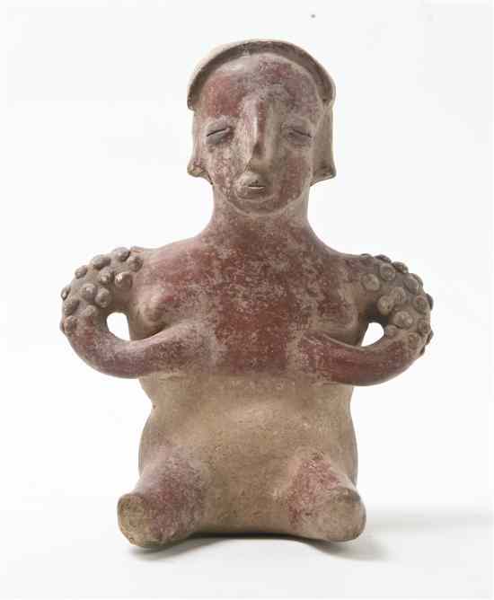 Appraisal: A Jalisco Style Pottery Figure the seated female depicted with