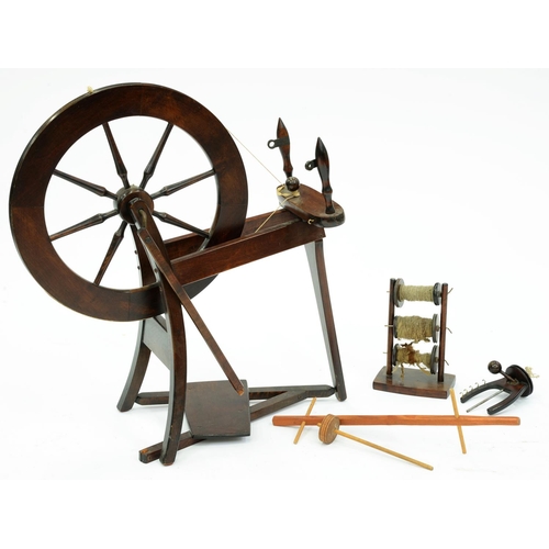 Appraisal: A mahogany and mahogany-stained wood spinning wheel first half th