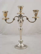 Appraisal: An American white metal tests silver three light candelabra by