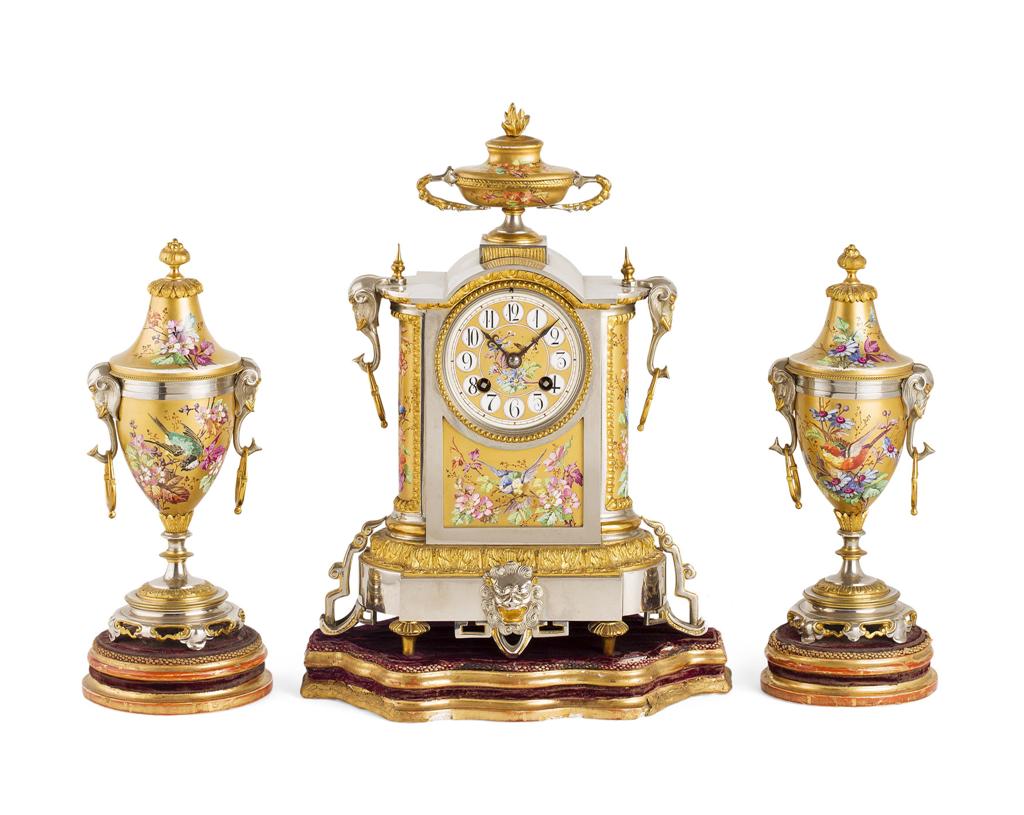 Appraisal: FRENCH GILT AND SILVERED METAL THREE PIECE CLOCK GARNITURE TH