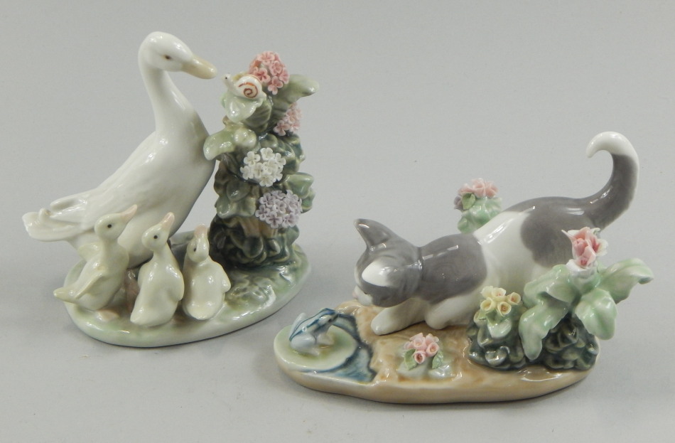 Appraisal: A pair of Lladro porcelain flower encrusted figures one in