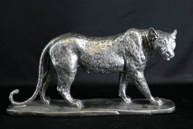 Appraisal: A sculpture of a leopard with metallic finish cm long