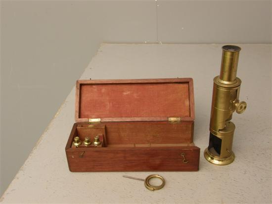 Appraisal: th century brass travelling microscope in mahogany case h in