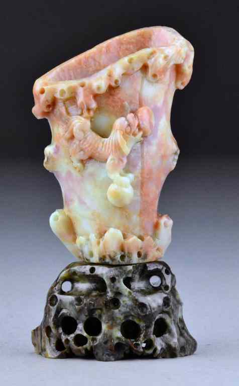 Appraisal: Chinese Qing Carved Soapstone VaseOf Rython form carved to depict