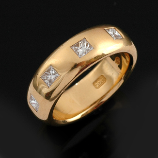 Appraisal: A princess cut diamond band The ct gold wide band