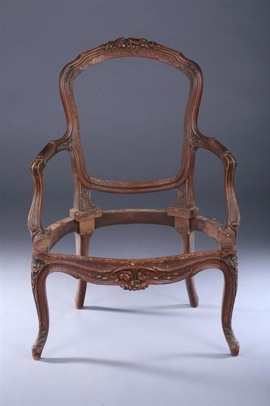 Appraisal: FRENCH LOUIS XV STYLE CARVED WALNUT FAUTEUIL FRAME late th