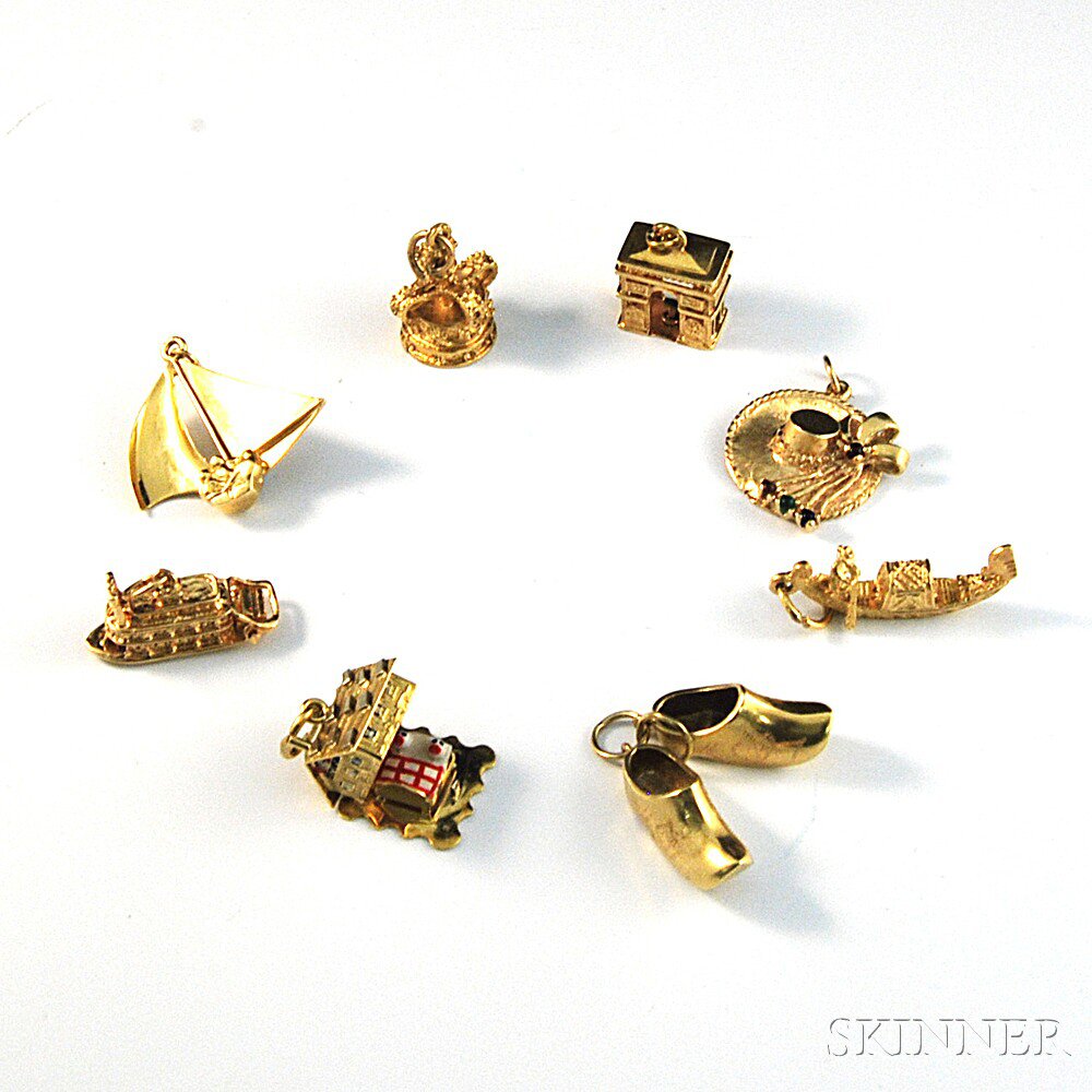 Appraisal: Group of Gold Charms including a kt gold sailboat a