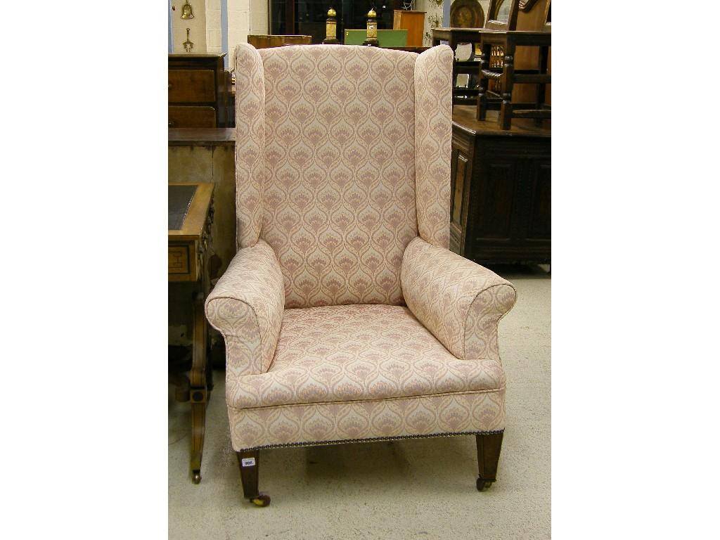 Appraisal: Large th century mahogany framed wing armchair with pink and