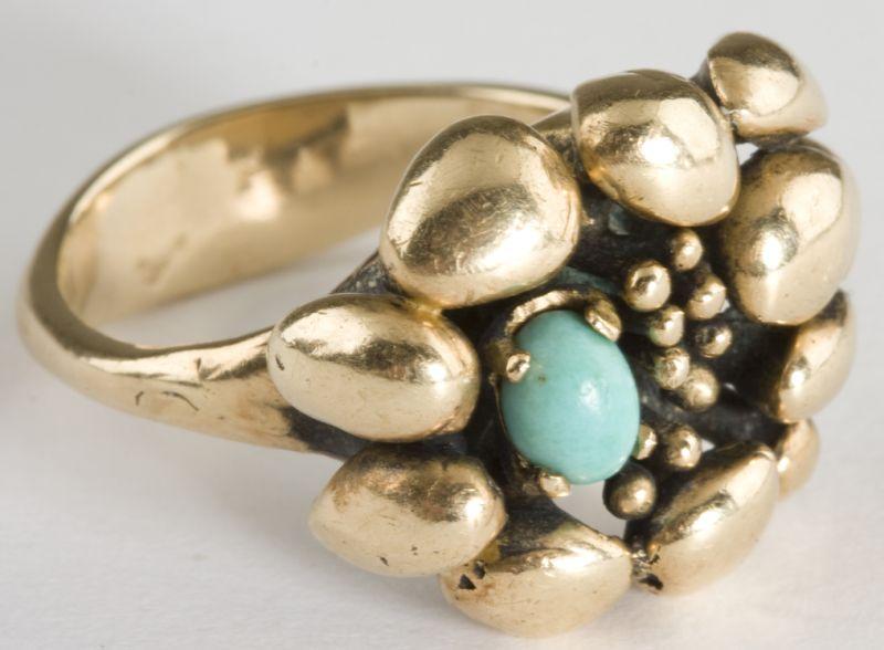 Appraisal: KT Handmade Turquoise Ring set with various shaped polished gold