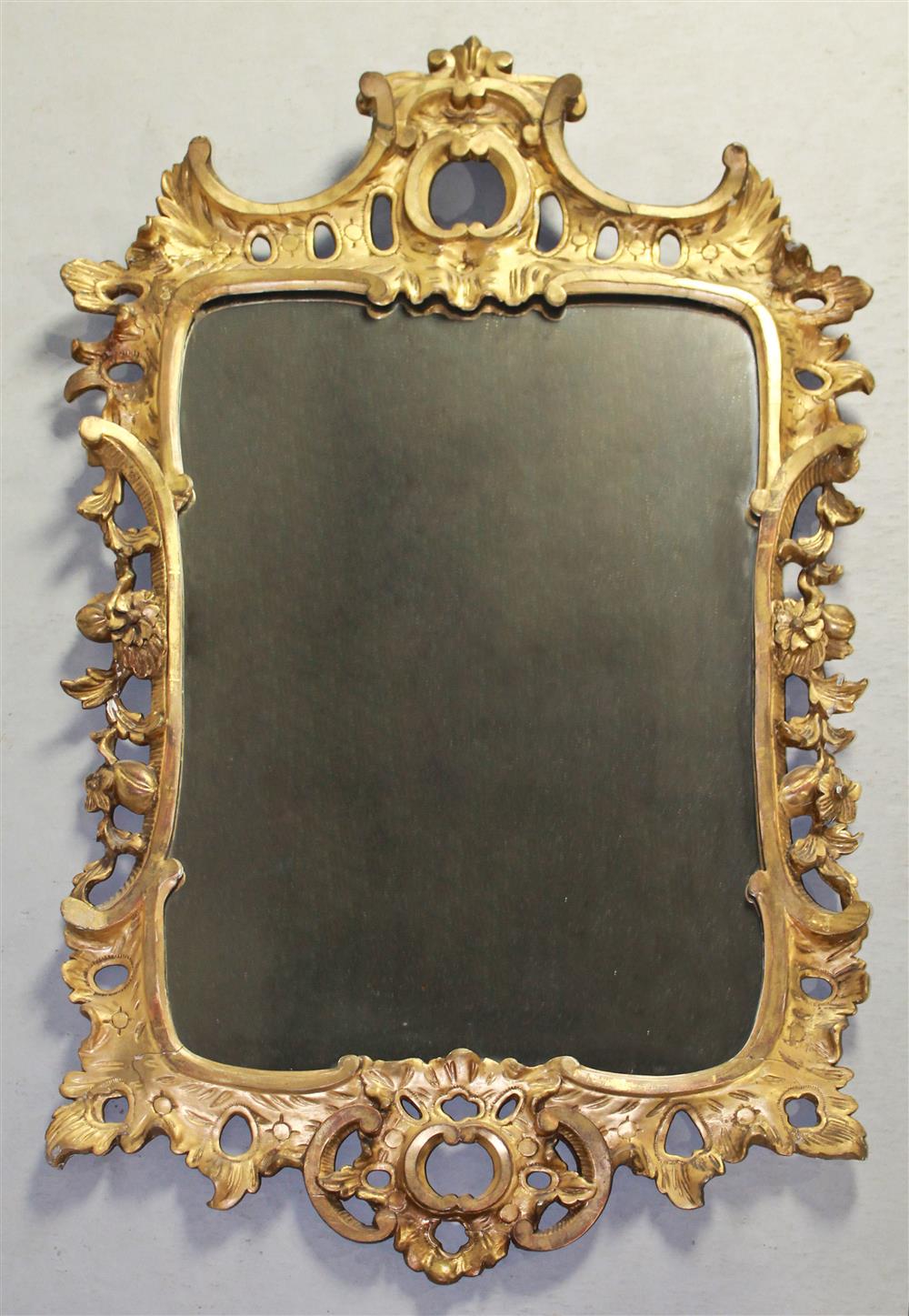 Appraisal: CHINESE CHIPPENDALE STYLE CARVED AND GILDED MIRROR having an arched