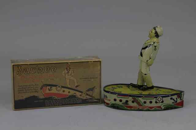 Appraisal: JACKIE THE HORN PIPE DANCER TOY Strauss boxed example lithographed