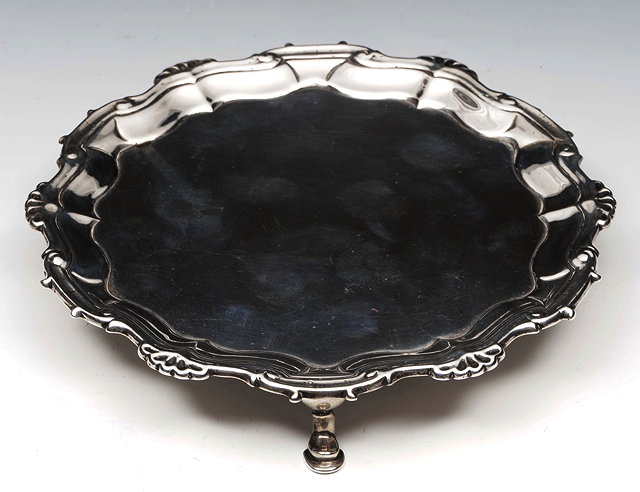 Appraisal: A GEORGE II SILVER WAITER with shell and scroll border