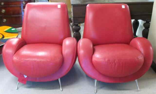 Appraisal: A PAIR OF ROSE LEATHER RETRO ARMCHAIRS Fishels Contemporary Home