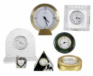 Appraisal: Seven Table Clocks French and English by Baccarat Hermes Tourneau