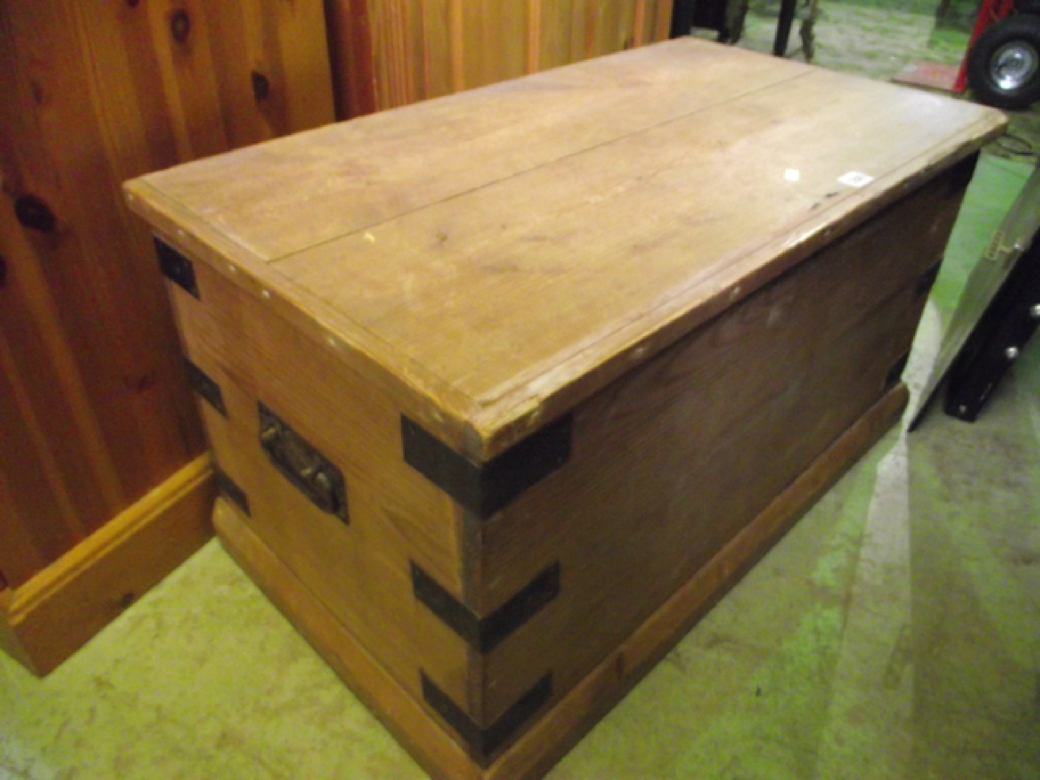 Appraisal: A Victorian pine blanket chest with steel banded border