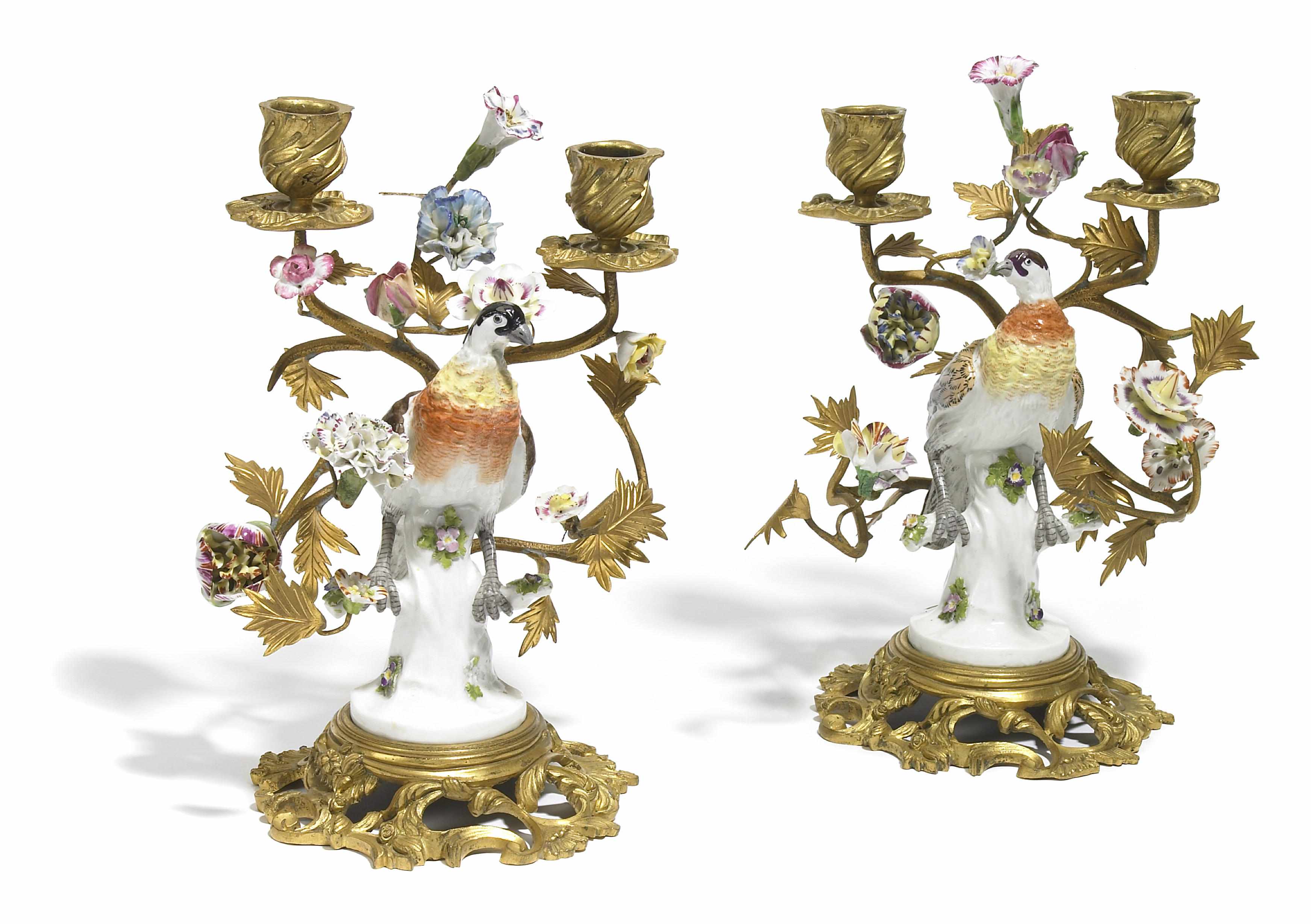 Appraisal: A pair of Continental porcelain and gilt bronze two light