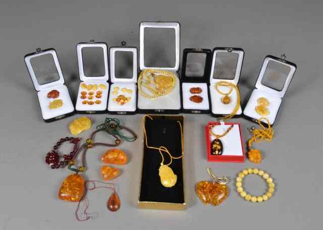 Appraisal: Chinese Carved Amber Stones Inc JewleryCarved to depict various things