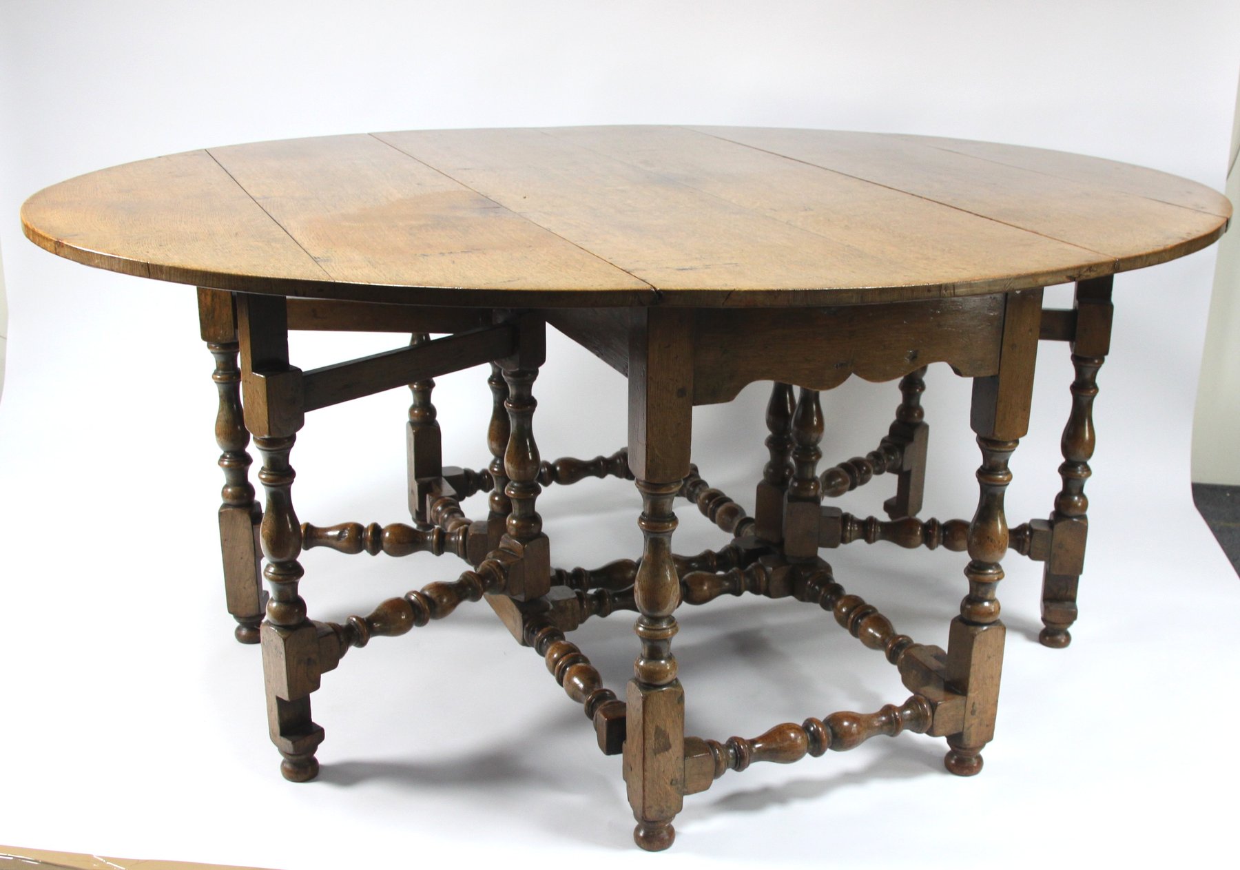 Appraisal: A large oak double gateleg table of th Century design