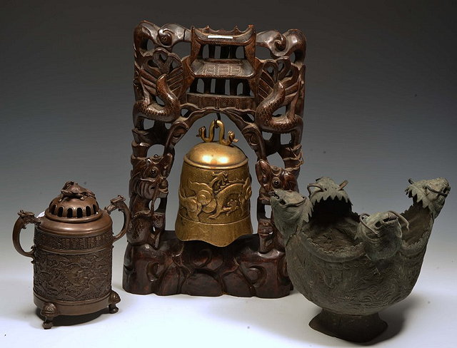 Appraisal: A CHINESE BRONZE METAL BELL on a hardwood stand with