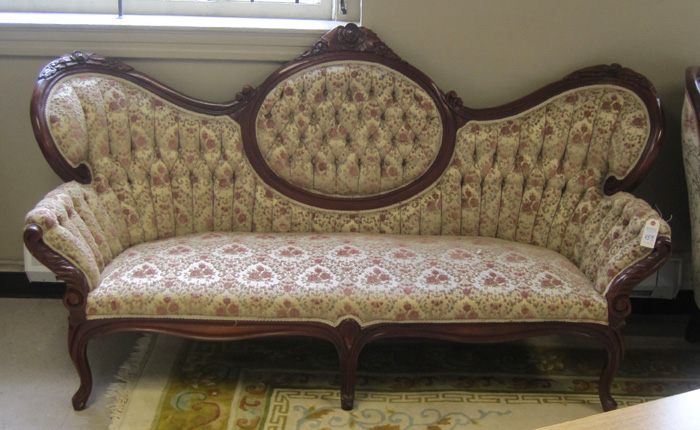 Appraisal: A VICTORIAN STYLE MEDALLION-BACK SOFA American th century having a