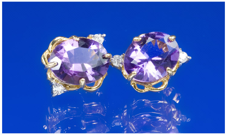 Appraisal: ct Gold Amethyst And Diamond Earrings Large Central Oval Amethyst