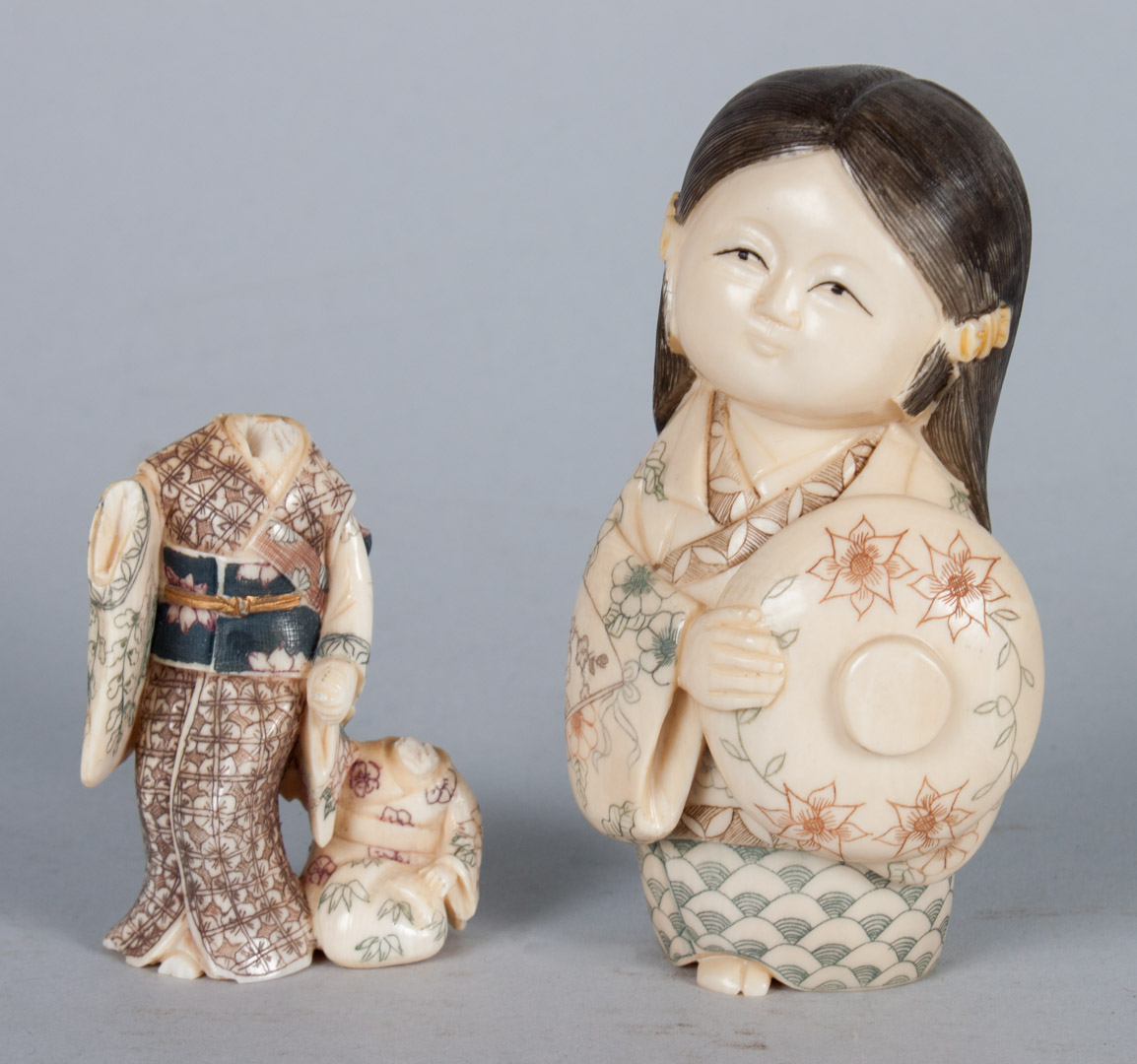 Appraisal: Japanese carved ivory child modeled as young girl holding hat